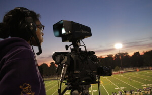 Student Brianna films at athletic event