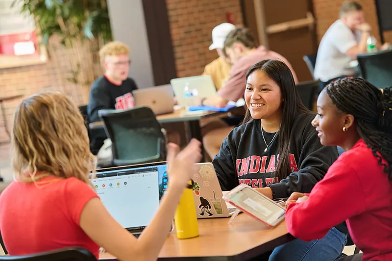 IWU Campus Students at Table