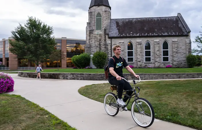 IWU Student on Bicycle