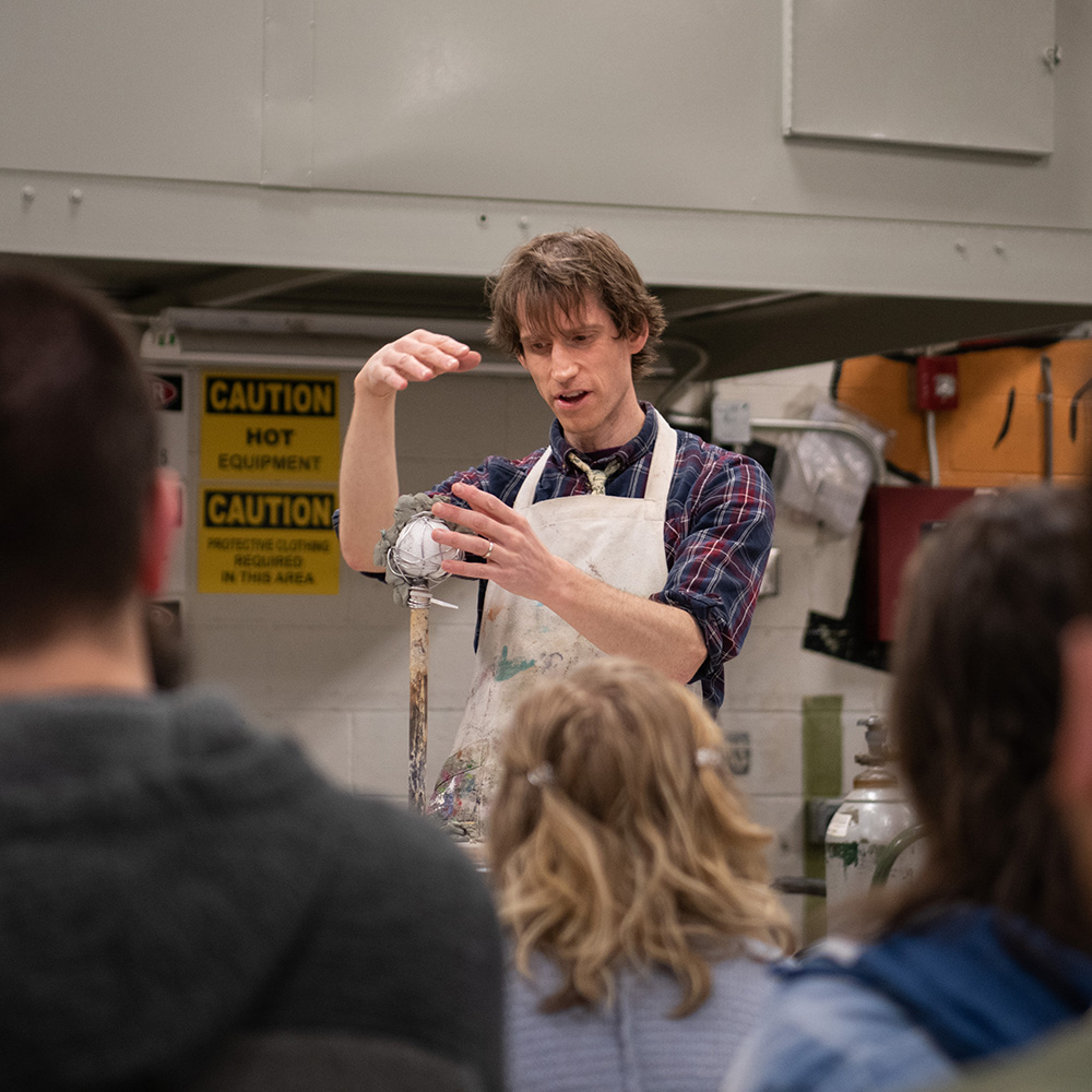 Faculty member teaching a sculpture class