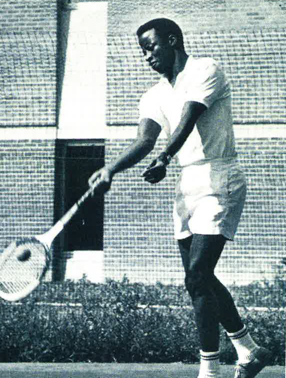 A young Francis Mustapha plays tennis