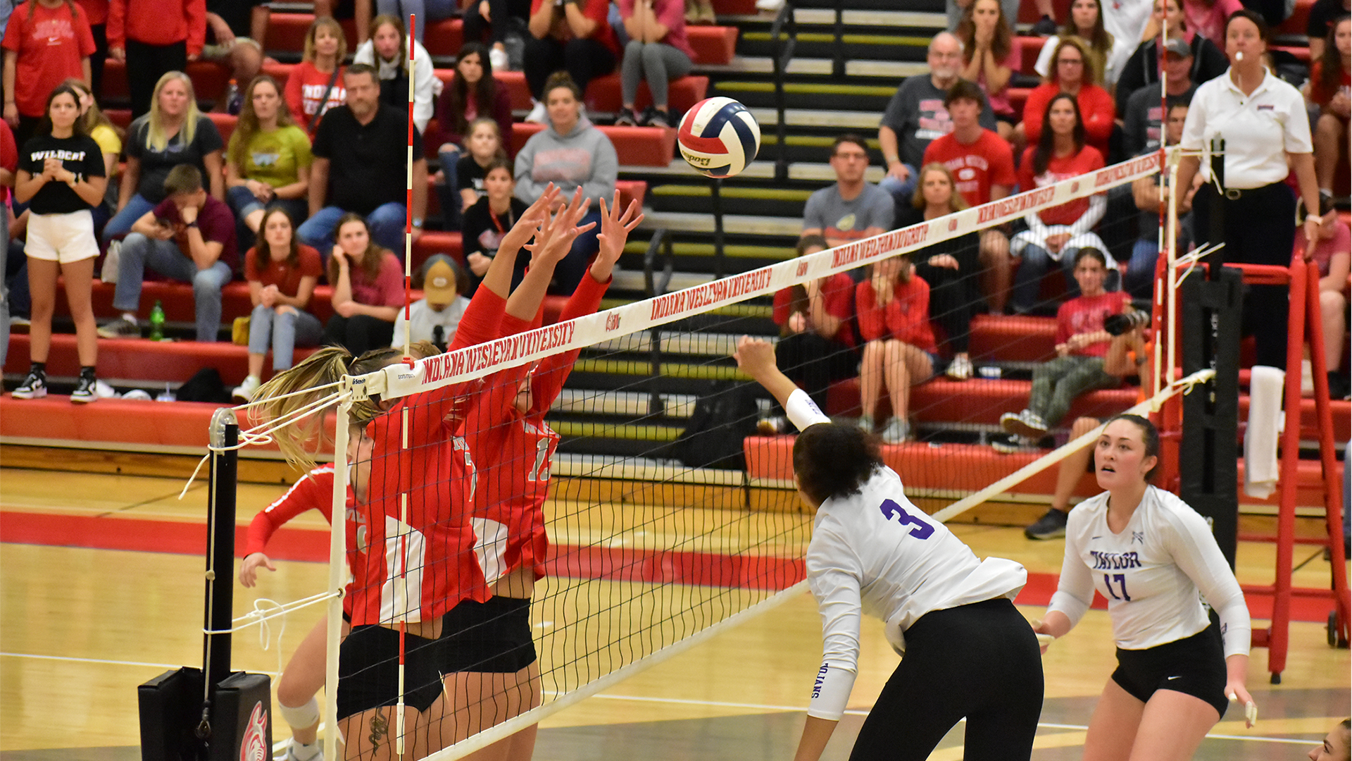 The Indiana Wesleyan volleyball team playing a match