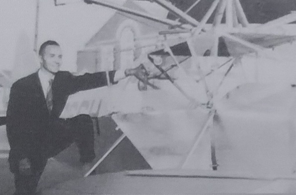 Lewis Jackson stands next to a prototype of the Versatile I prototype