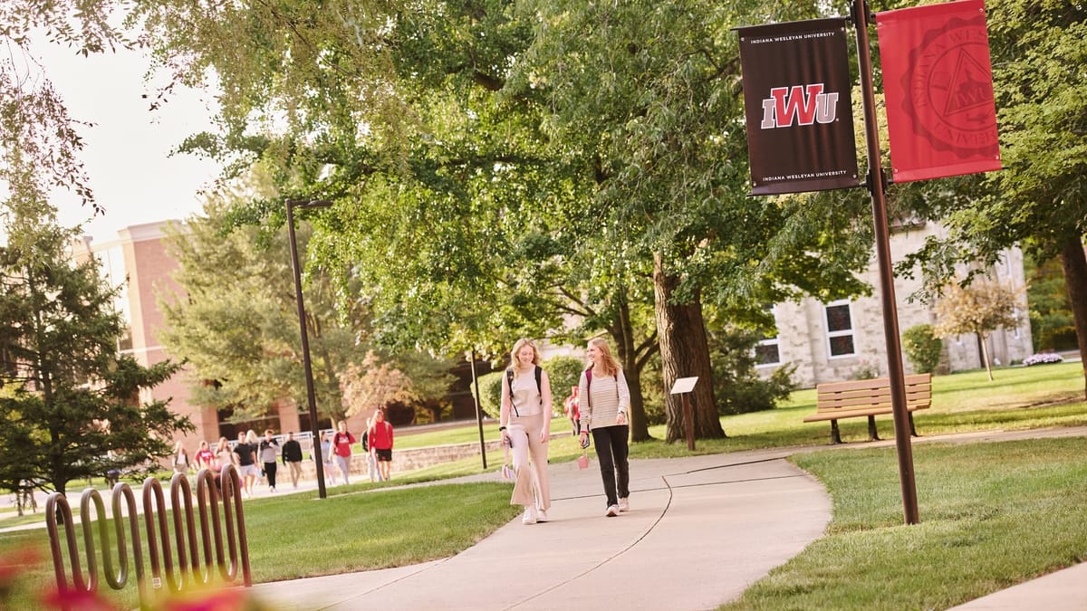Students walking across IWU campus