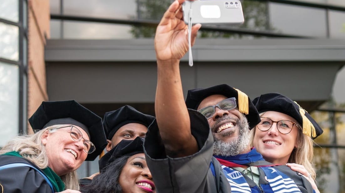 Graduates taking a selfie
