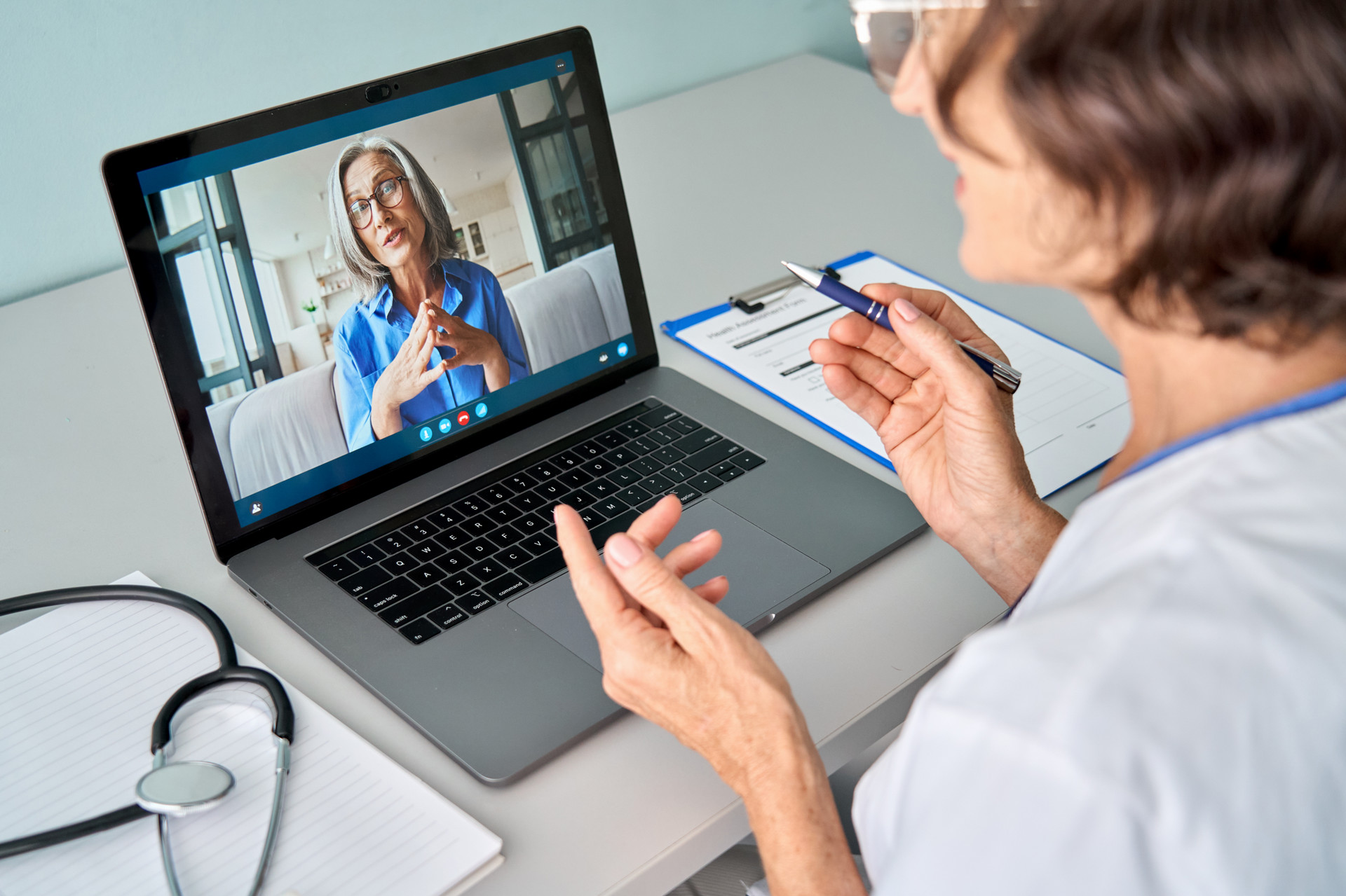 Woman talking to a counsellor via video call on a laptop