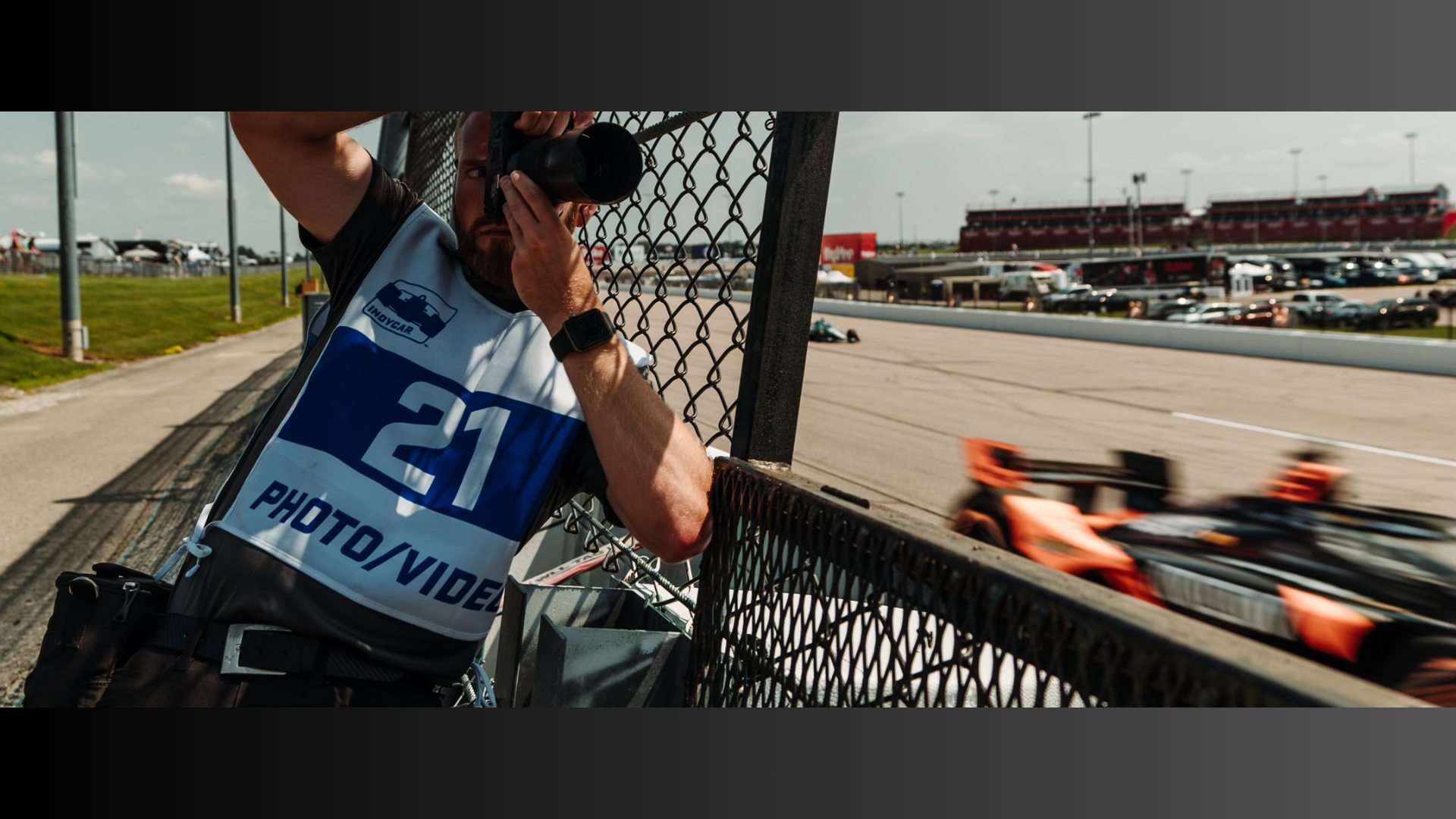 Jacob Quick taking a photo of race at IndyCar