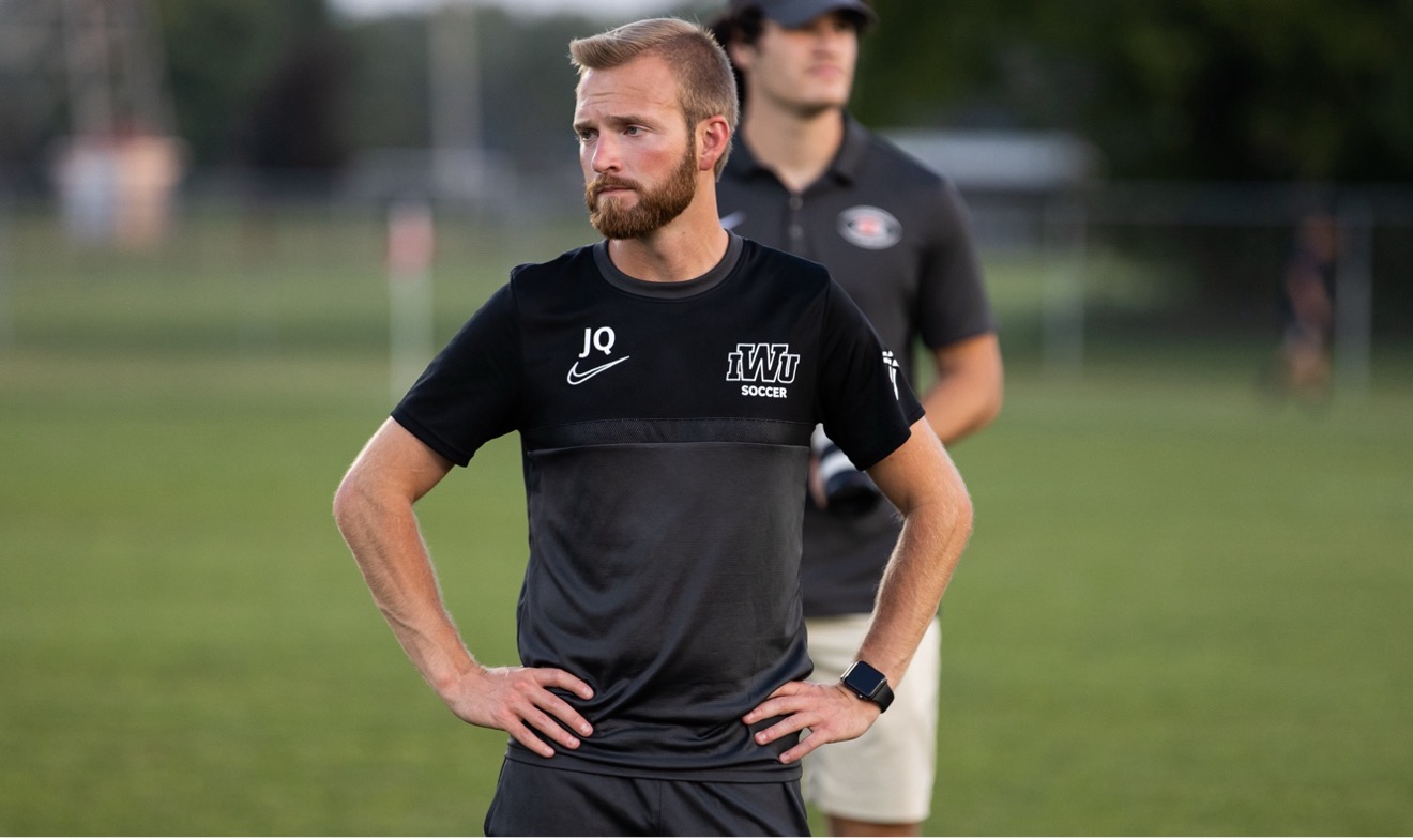 Jacob Quick in IWU shirt at sports event