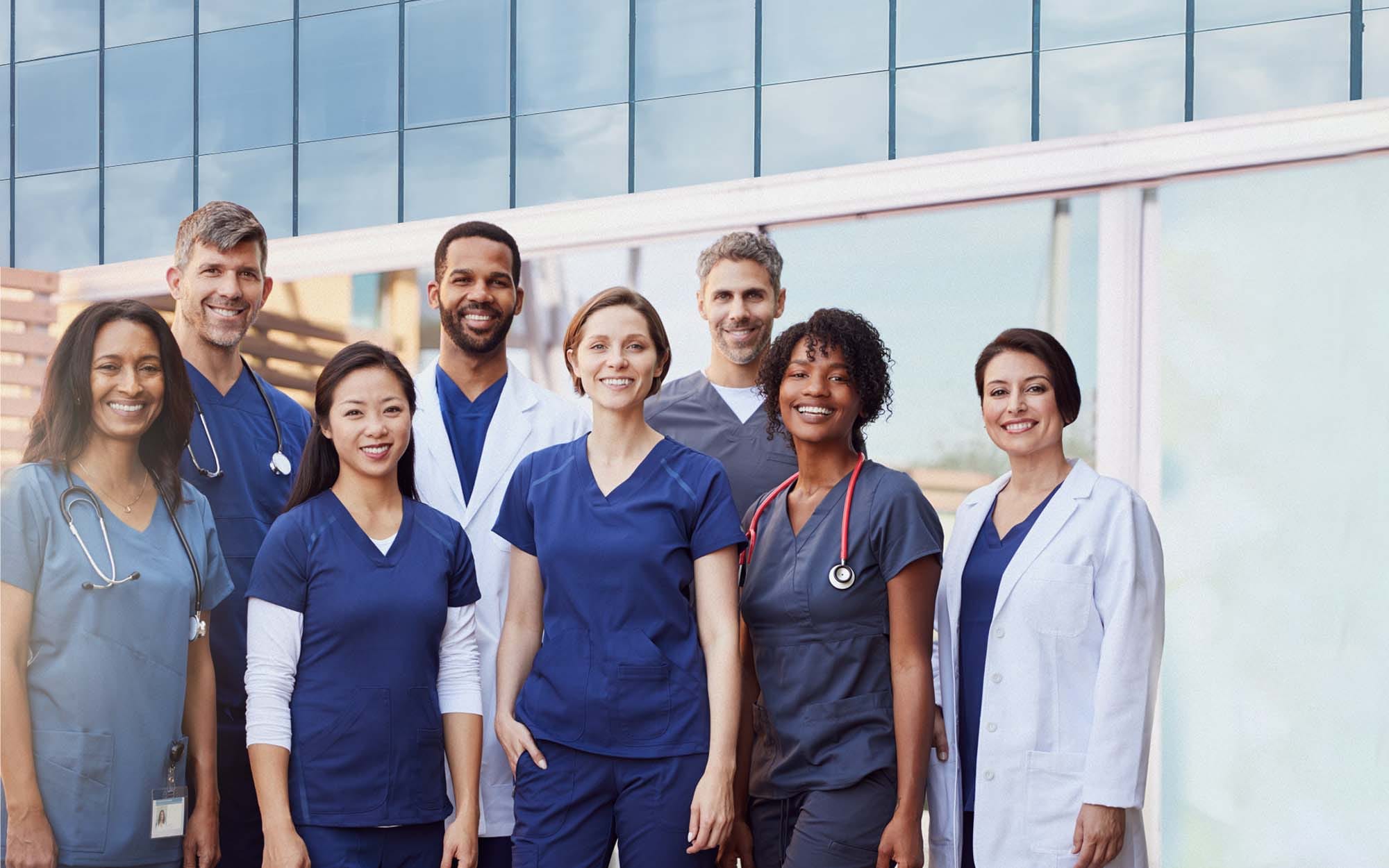 Group of nurses and doctors smiling at camera