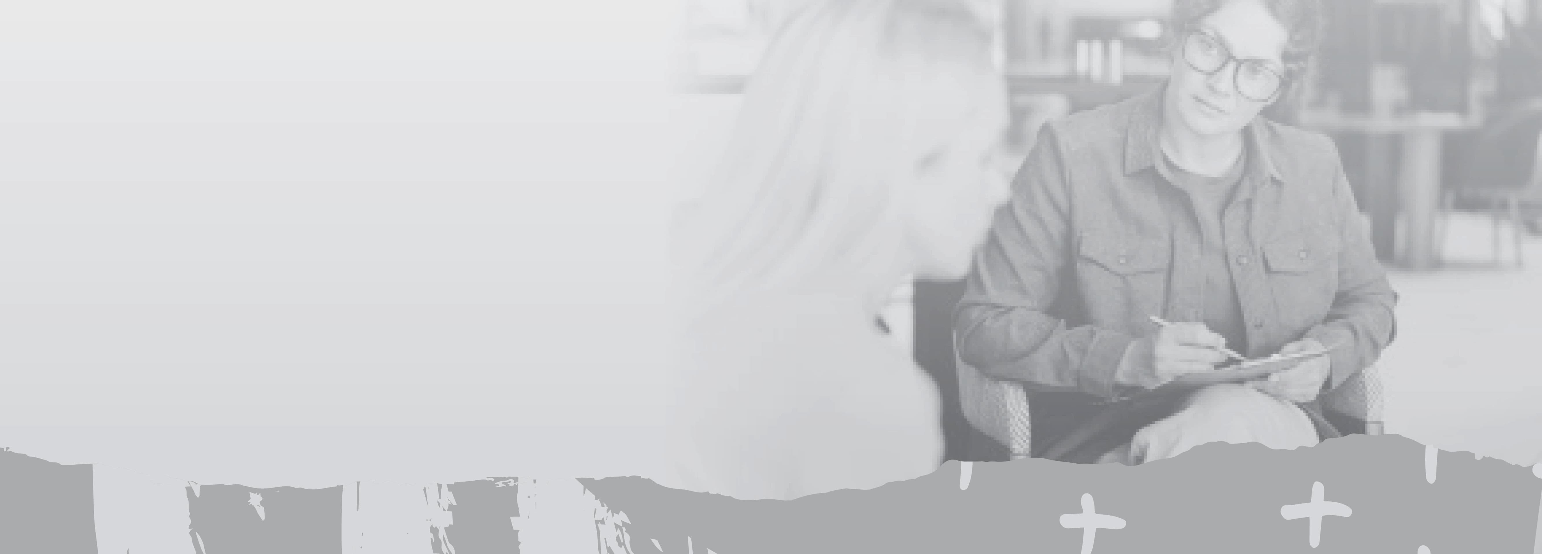 Counselor in chair listening to young woman talking.