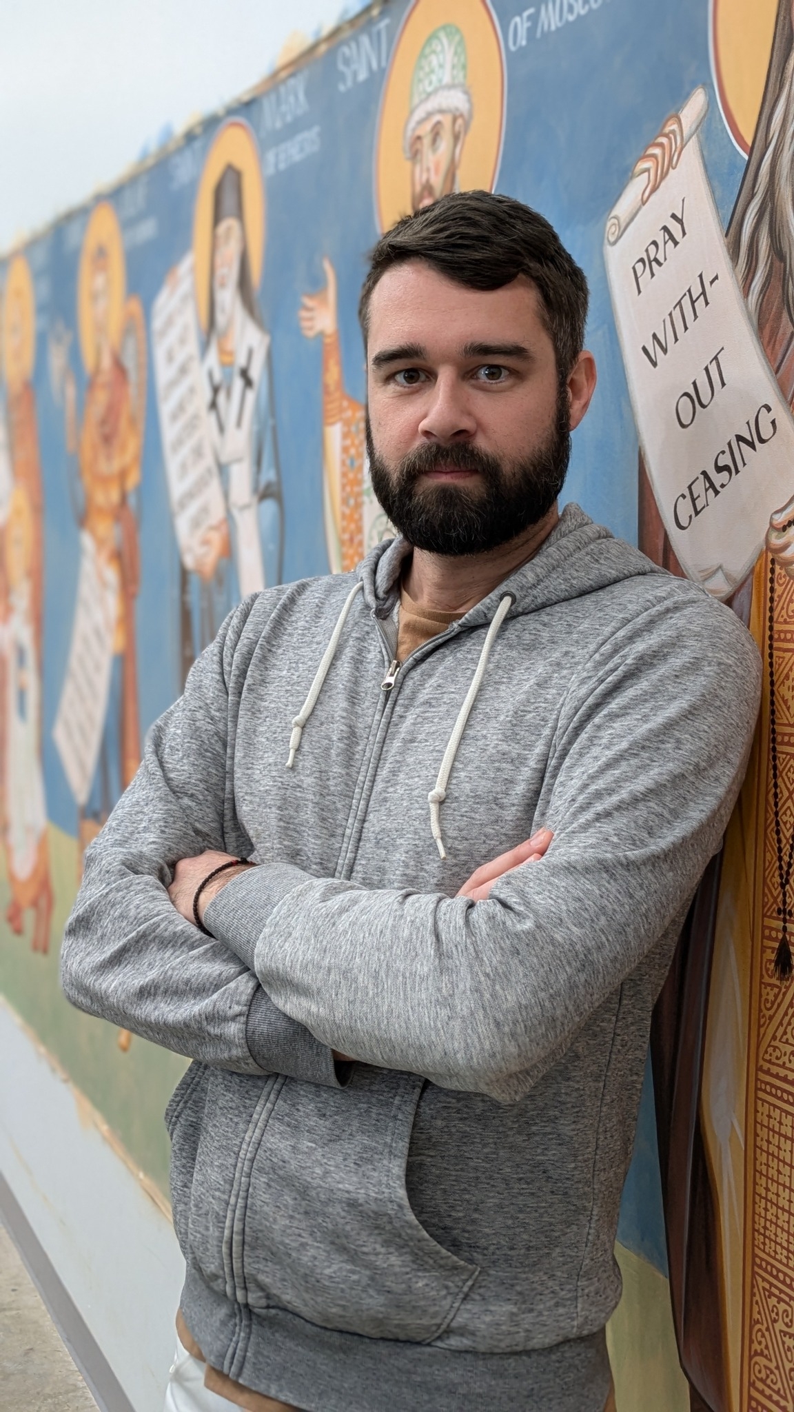 Brian Whirledge, from waist up, leaning against wall