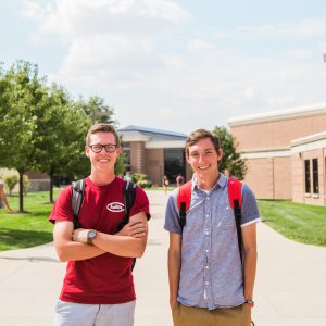 Two male students face the camera