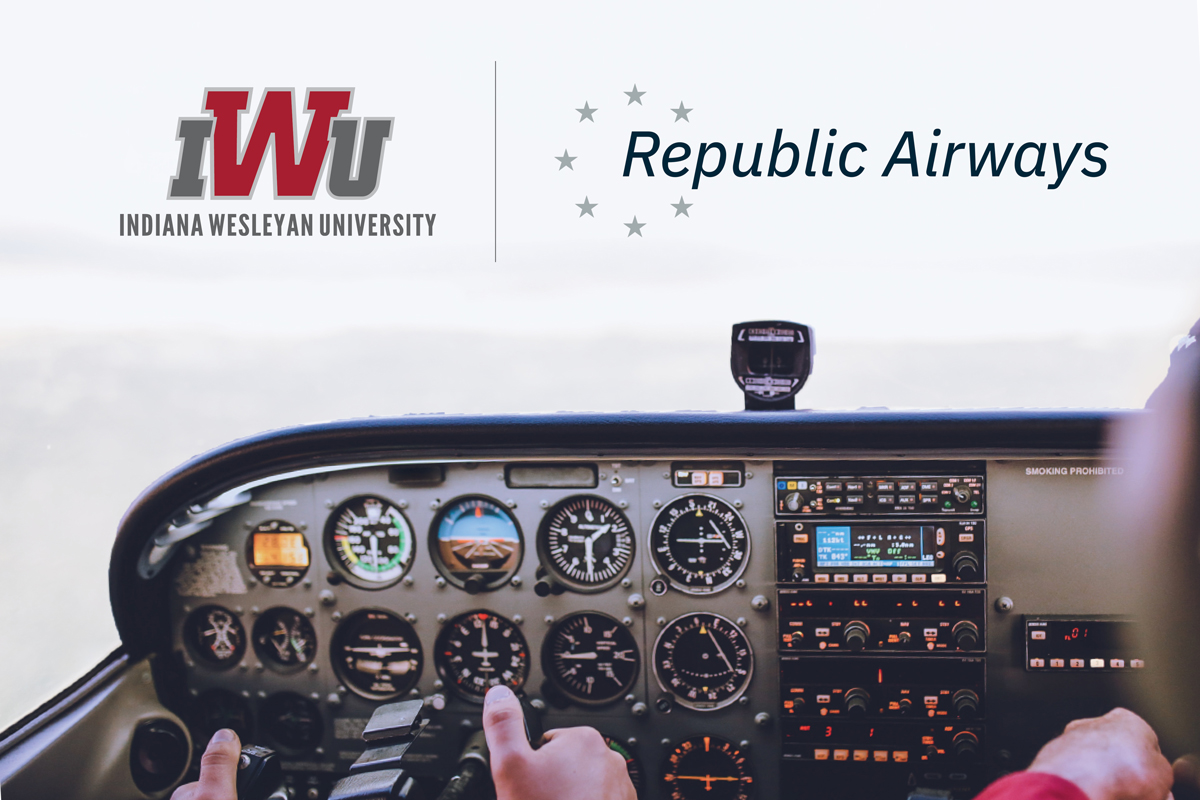 A photo of the cockpit of a plane. The logos for IWU and Republic Airways are above it.