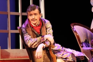 Student in IWU Theatre Guild acting in a play