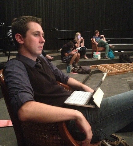 Daniel Maloy sits in the director chair