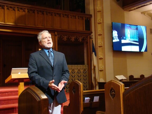 Dr. Greg Fiebig speaking in church