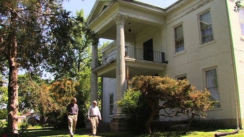 Munn and King look at Marion’s historic Swayzee-Love mansion.