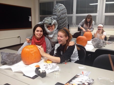 MAC Students carving pumpkins